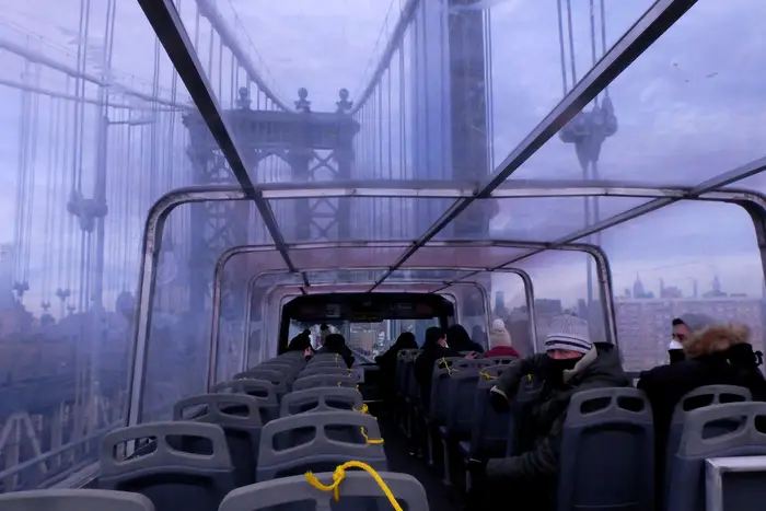 Sightseeing bus going over the Manhattan Bridge